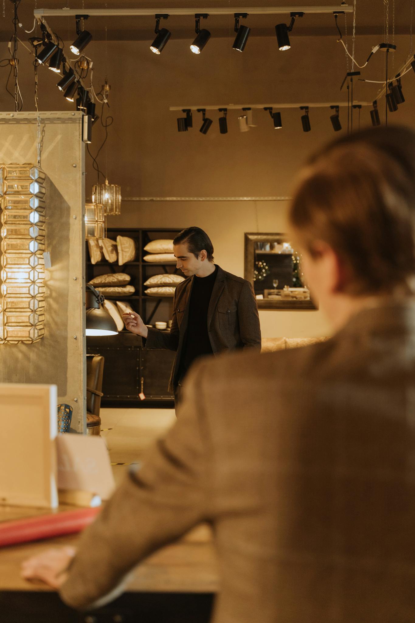 Man in a retail store exploring furniture options, creating a shopping ambiance.
